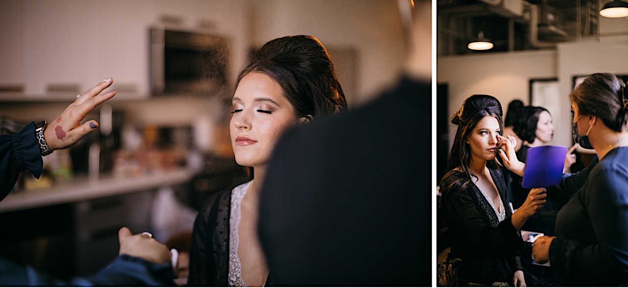 A bride closes her eyes while her makeup artist mists her face.