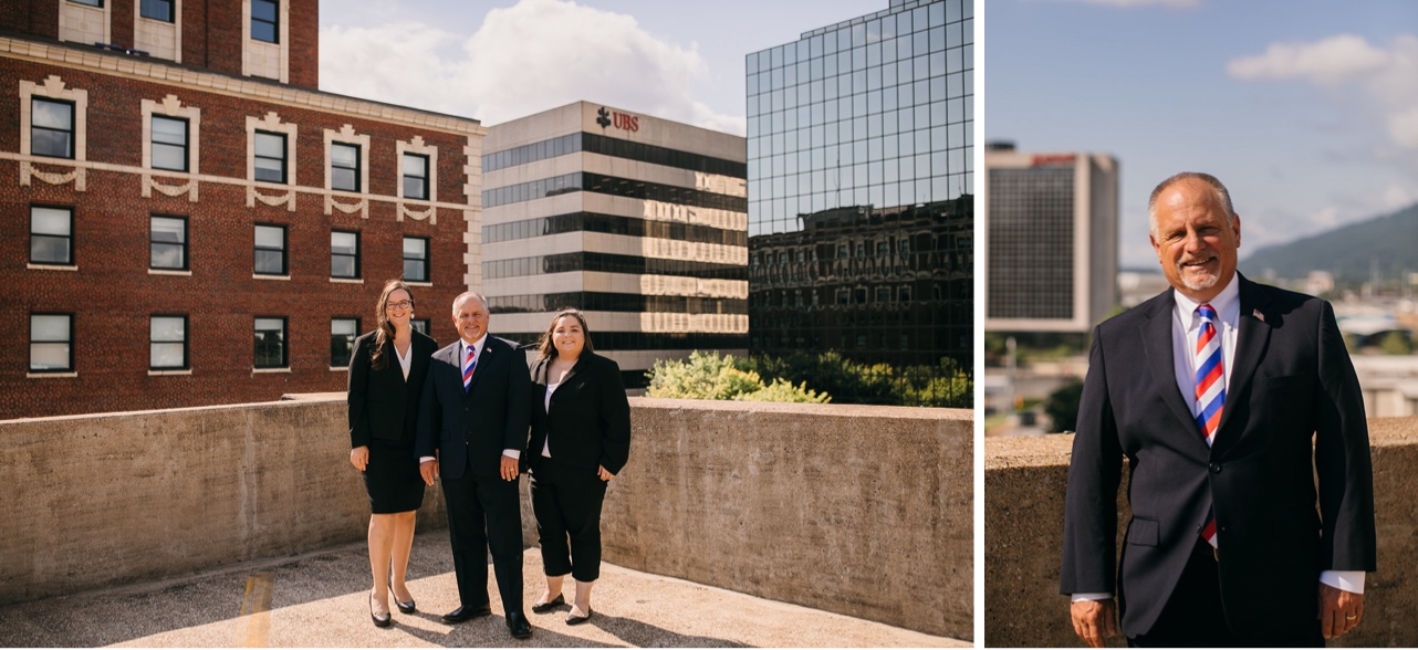 The owners of a law firm pose on a nearby parking garage, their office behind them.