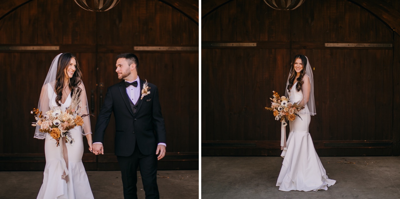 Bride poses with her bouquet in front of large wooden doors.