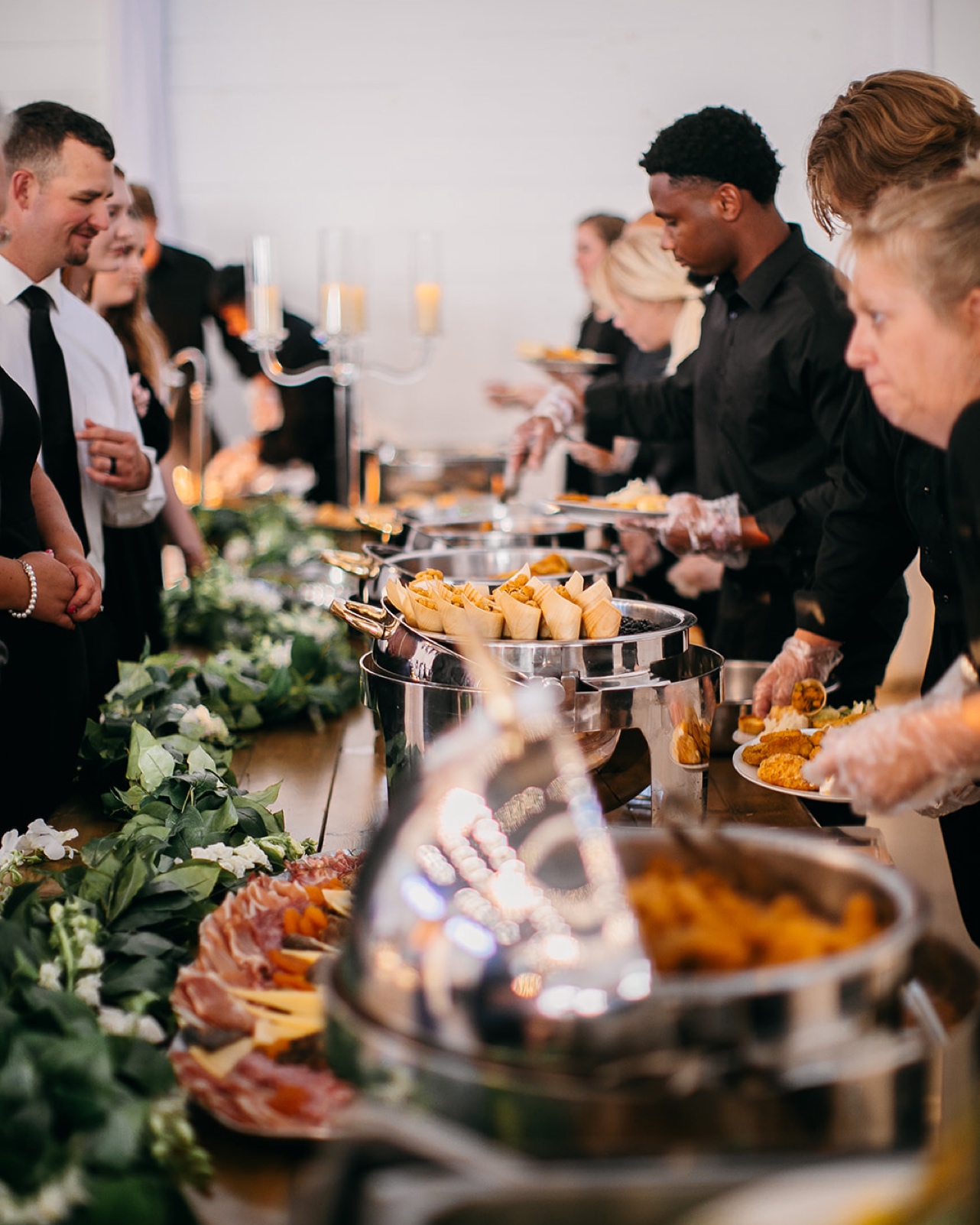 Guests fill their plates during the reception.