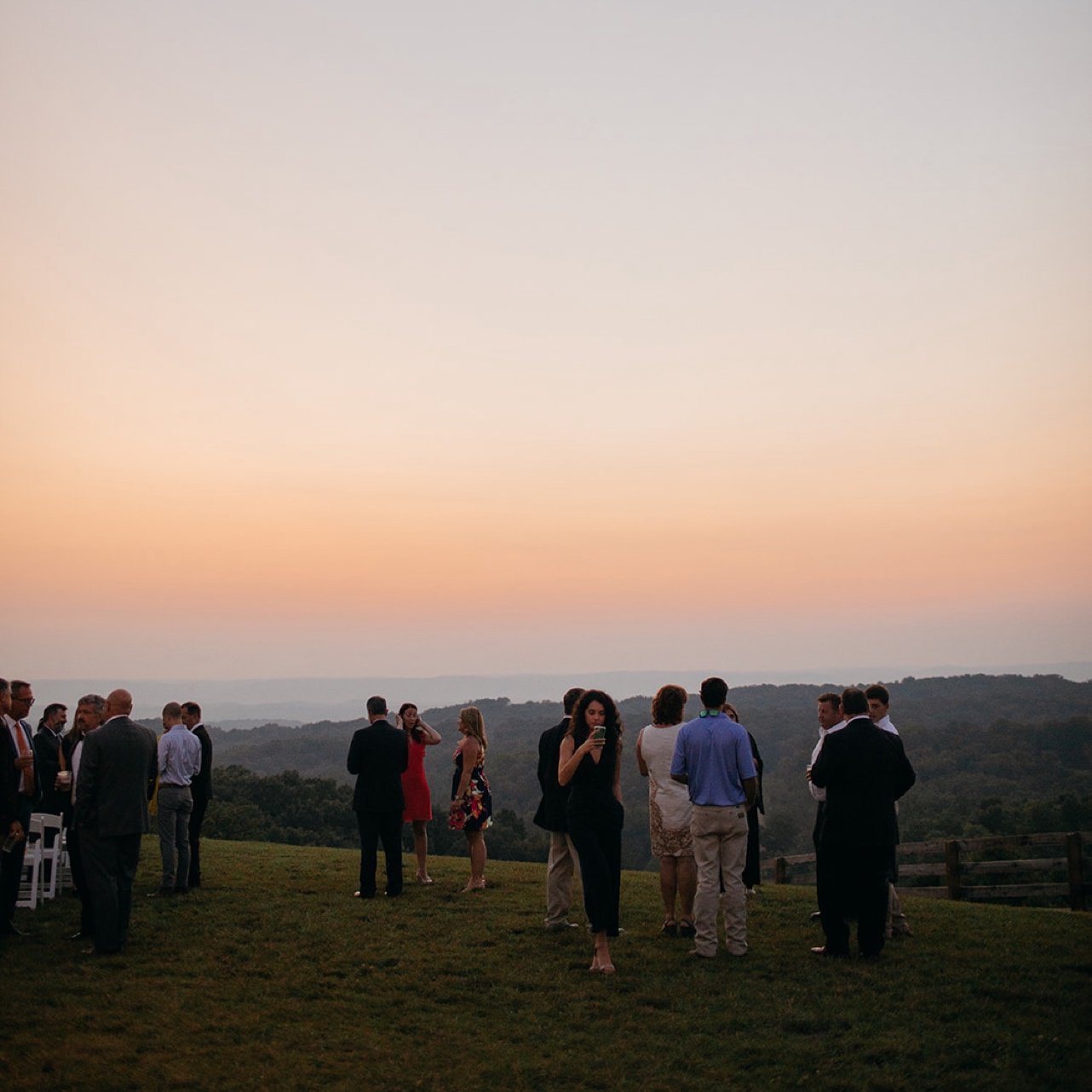 Guests enjoy the sunset over the hills at Howe Farms.