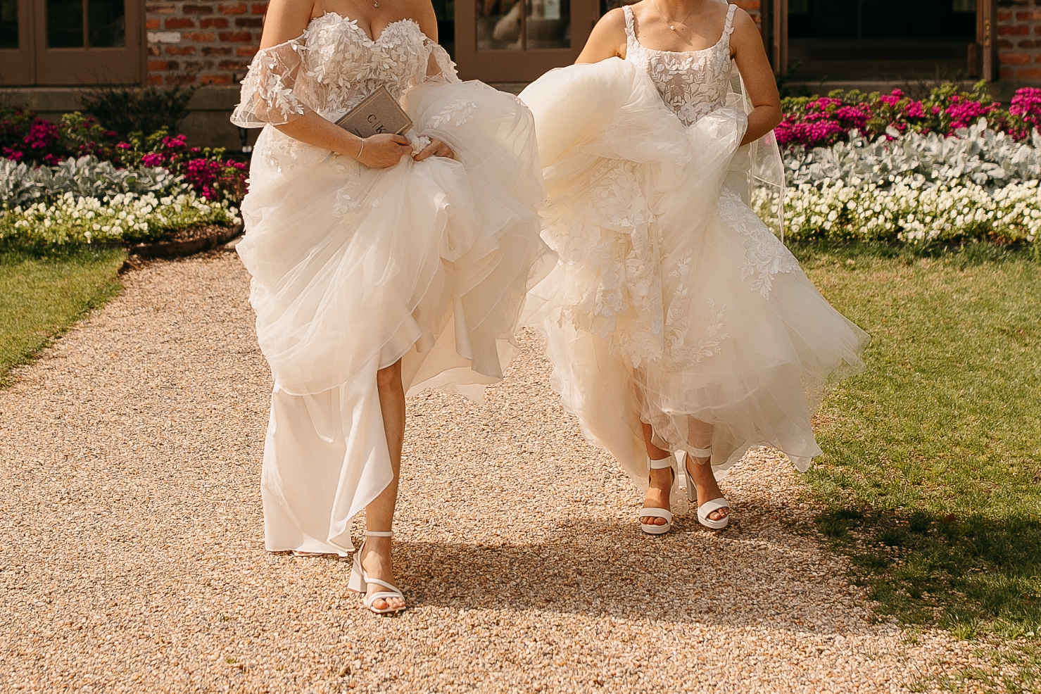 Couple running down path at their LSU Botanical Gardens wedding