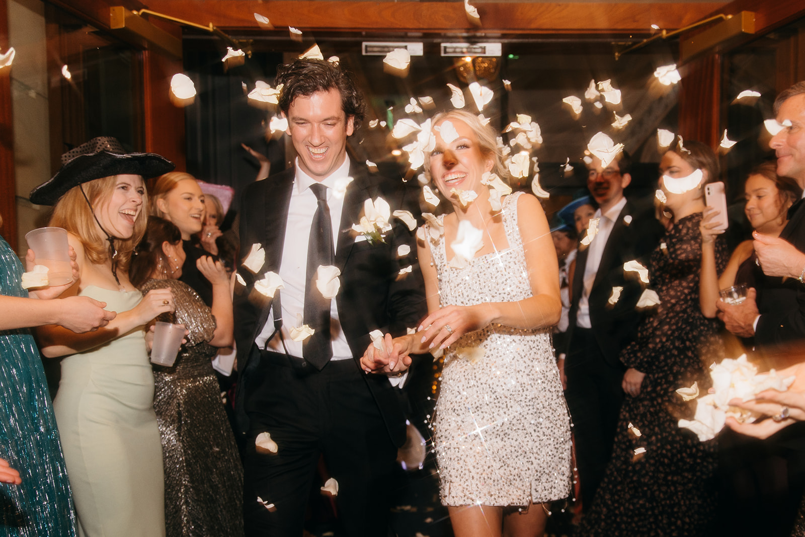 Bride and groom running through guests throwing confetti at The Read House wedding venue in Chattanooga TN