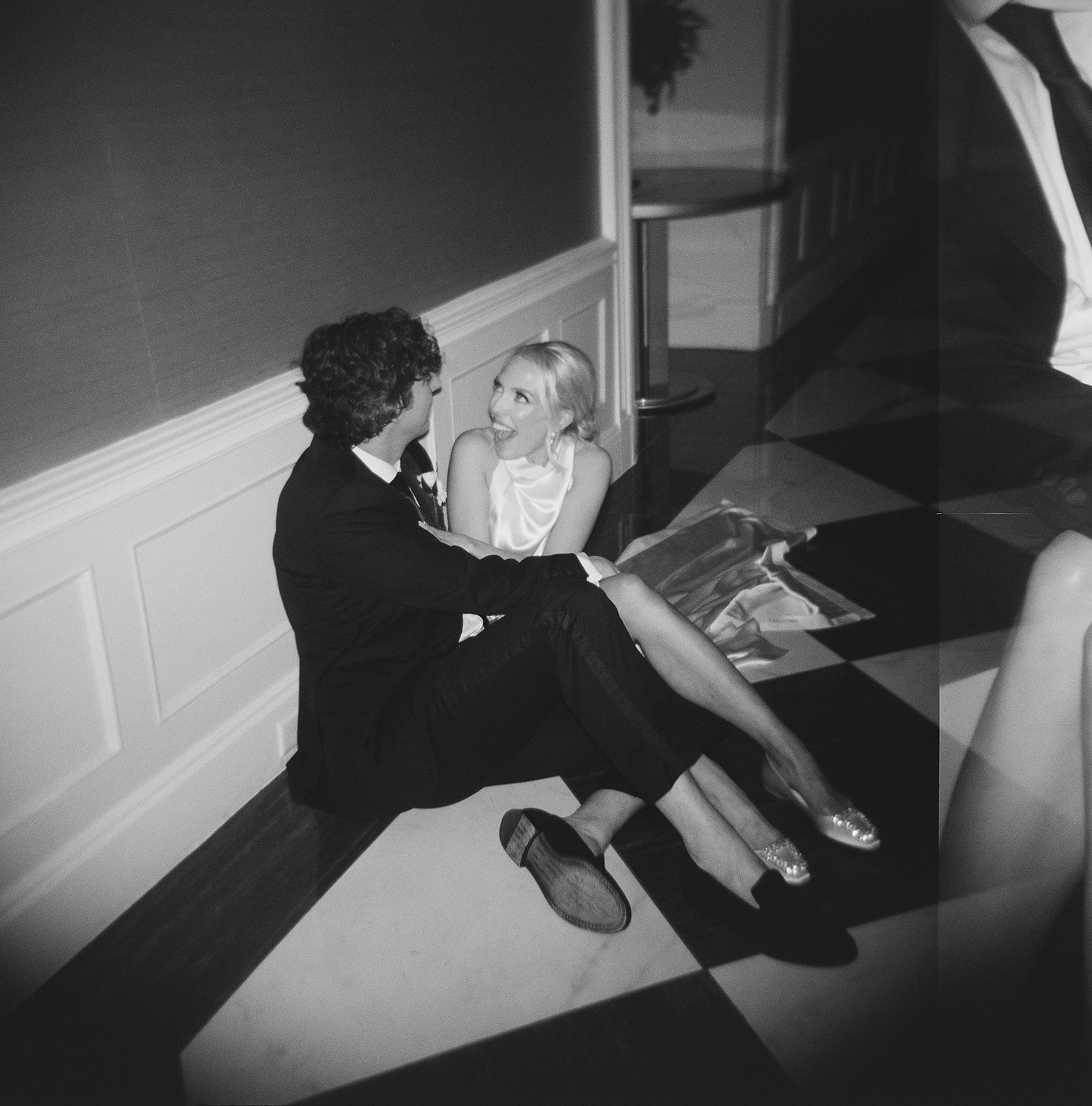 Couple posing on checkered floor at The Read House in Chattanooga