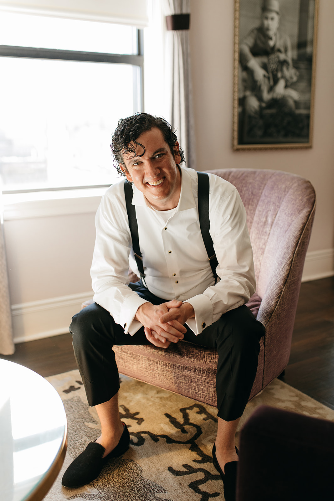 Groom sitting chair to before The Read House Wedding venue celebration 