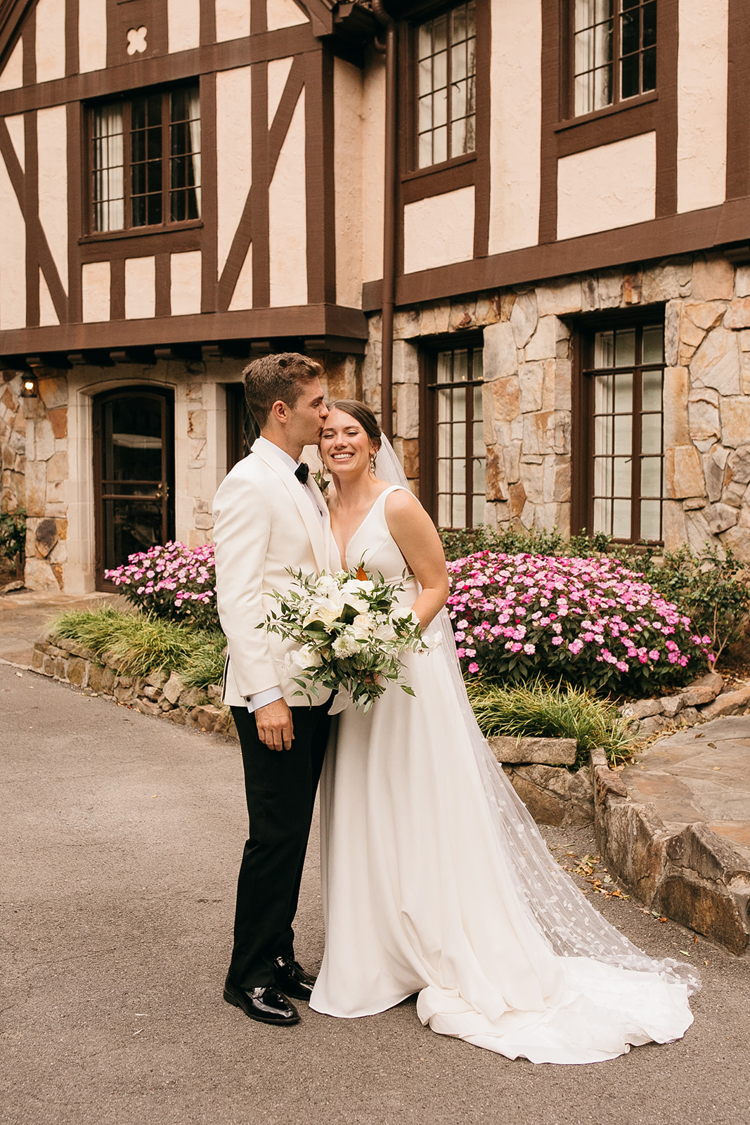 Bride and groom embracing at a top wedding venue in Chattanooga, TN outdoors. 
