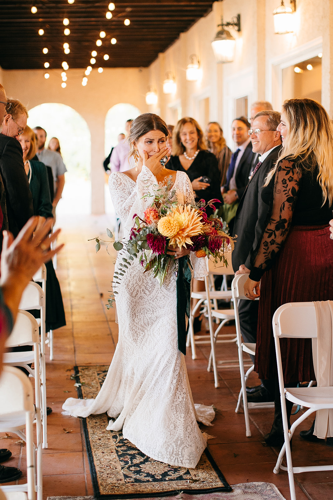 Bride walking down the aisle at Tennessee River Place, with hotels nearby Tennessee River Place for guests. 