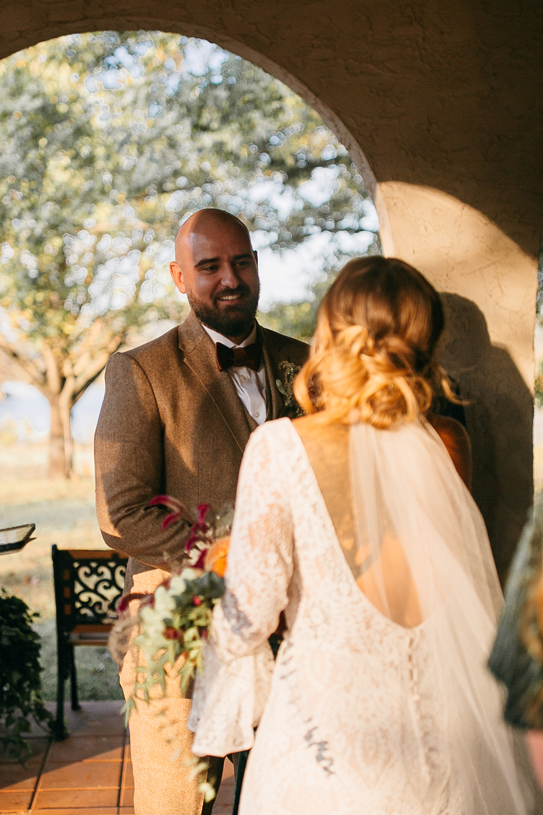 Groom smiling during an intimate ceremony moment at Tennessee River Place. Guests can stay at hotels near Tennessee River Place. 