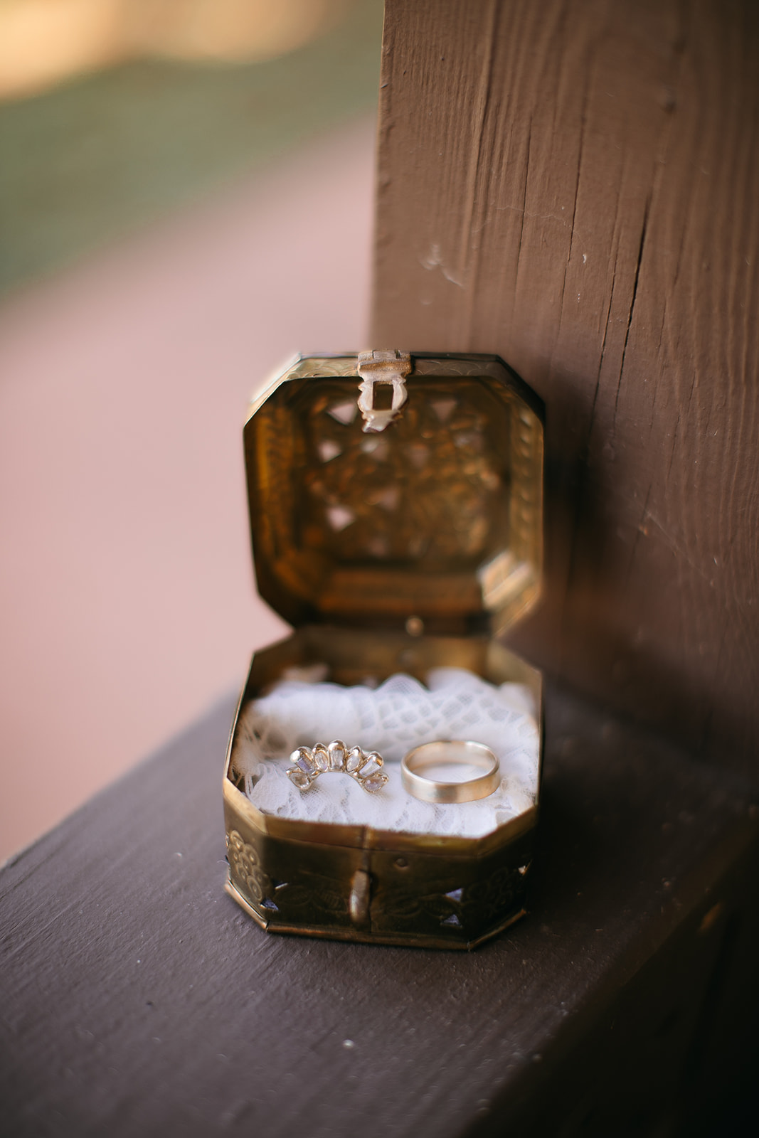 Wedding rings styled in a vintage box for Tennessee River Place photos. 