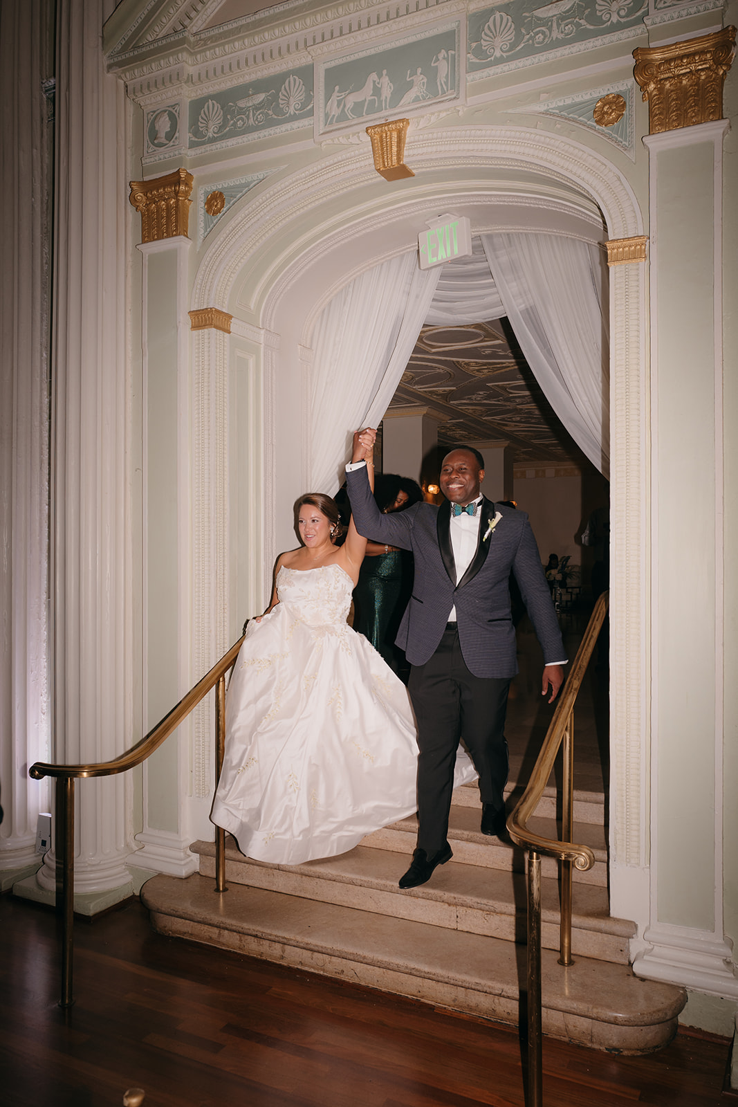 Bride and groom making their grand entrance into the reception at The Biltmore Ballrooms Atlanta. 