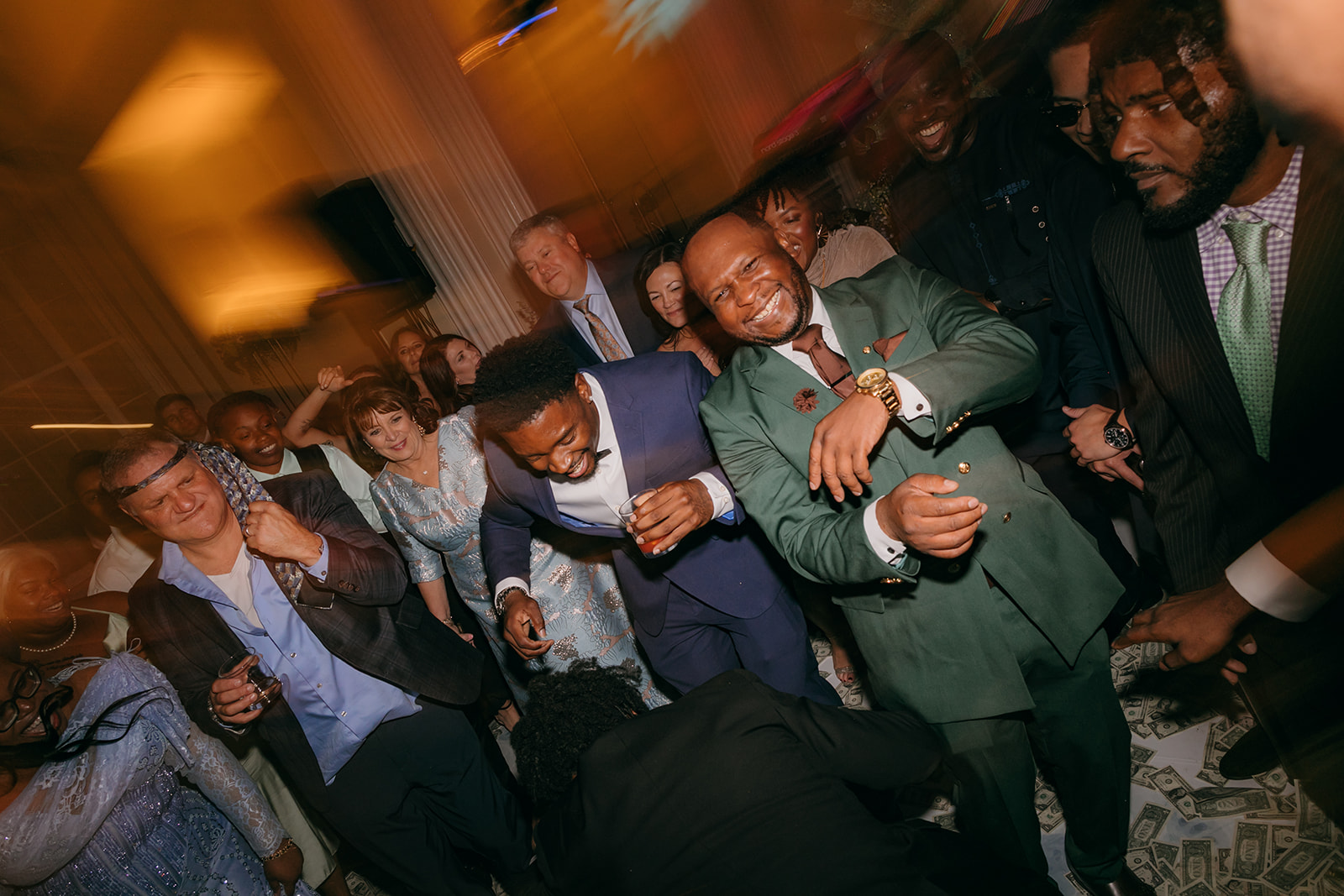 Guests dancing during a high-energy wedding reception at the Biltmore Ballroom Atlanta with money dance celebration. 