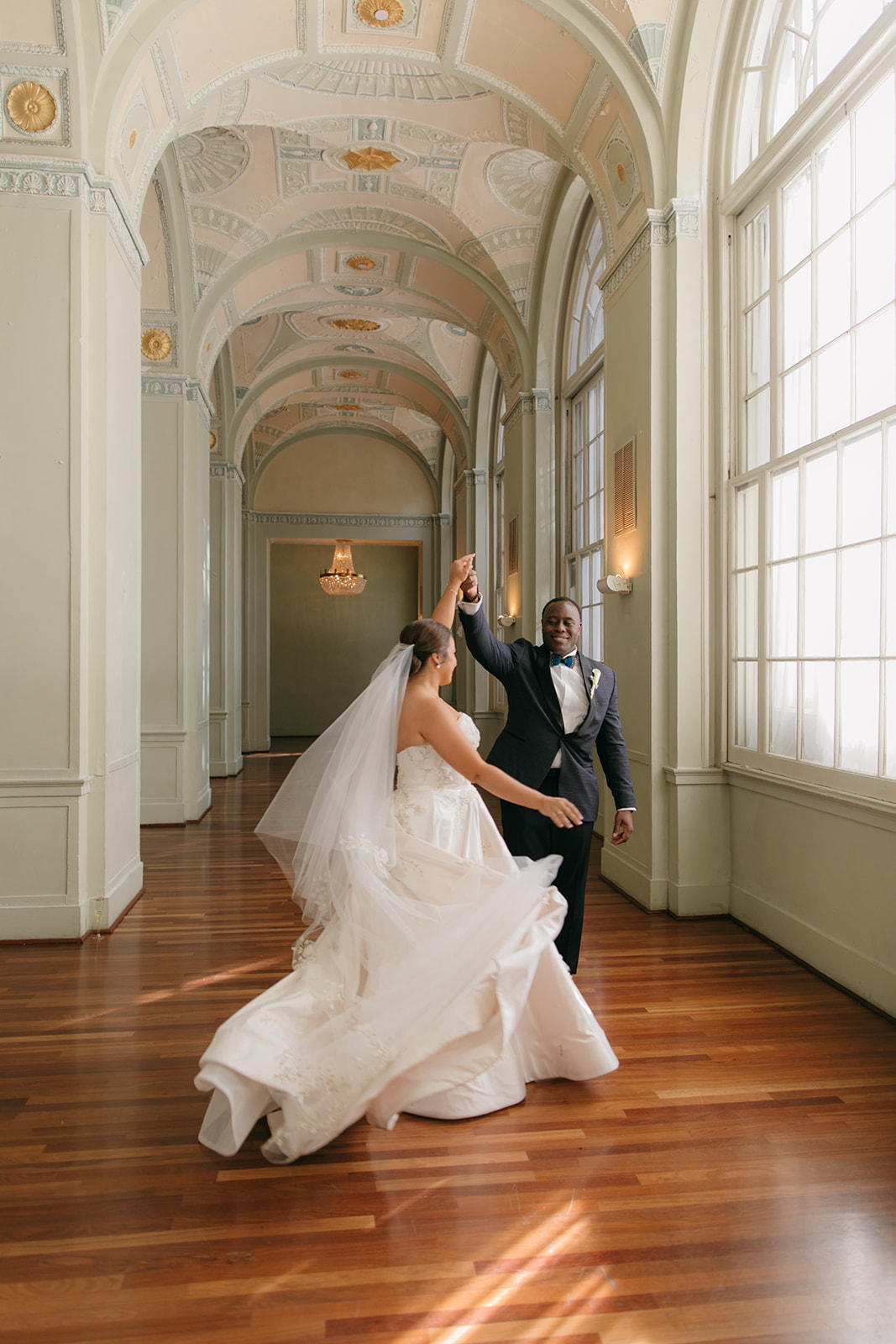 Bride and groom dancing together in the hallway at The Biltmore Ballrooms Atlanta wedding venue 