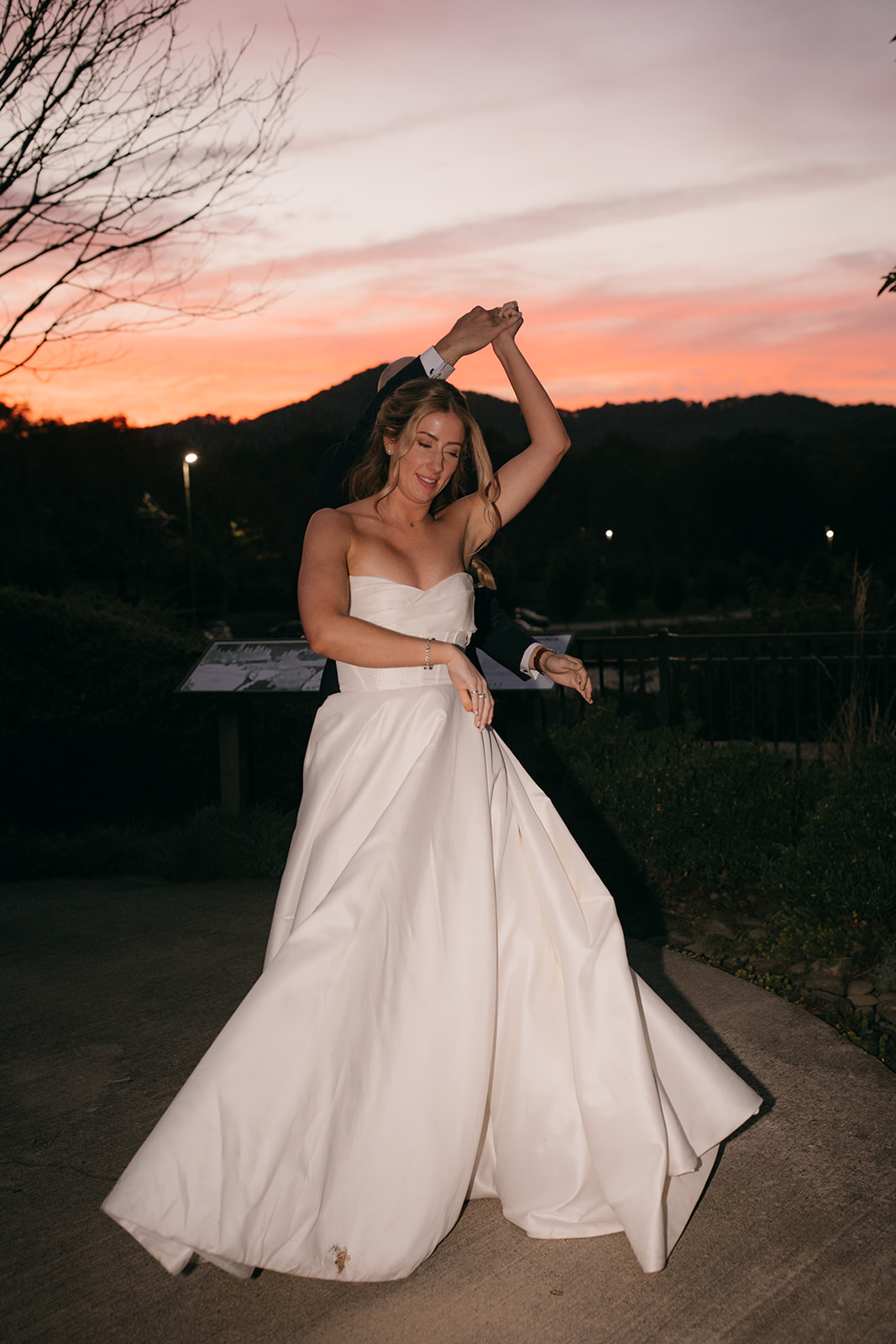 Bride and groom dancing at sunset at one of the most beautiful garden wedding venues NC has to offer. 