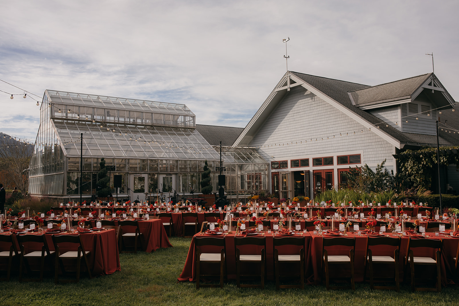 Outdoor reception setup beside the conservatory for an NC Arboretum wedding. 