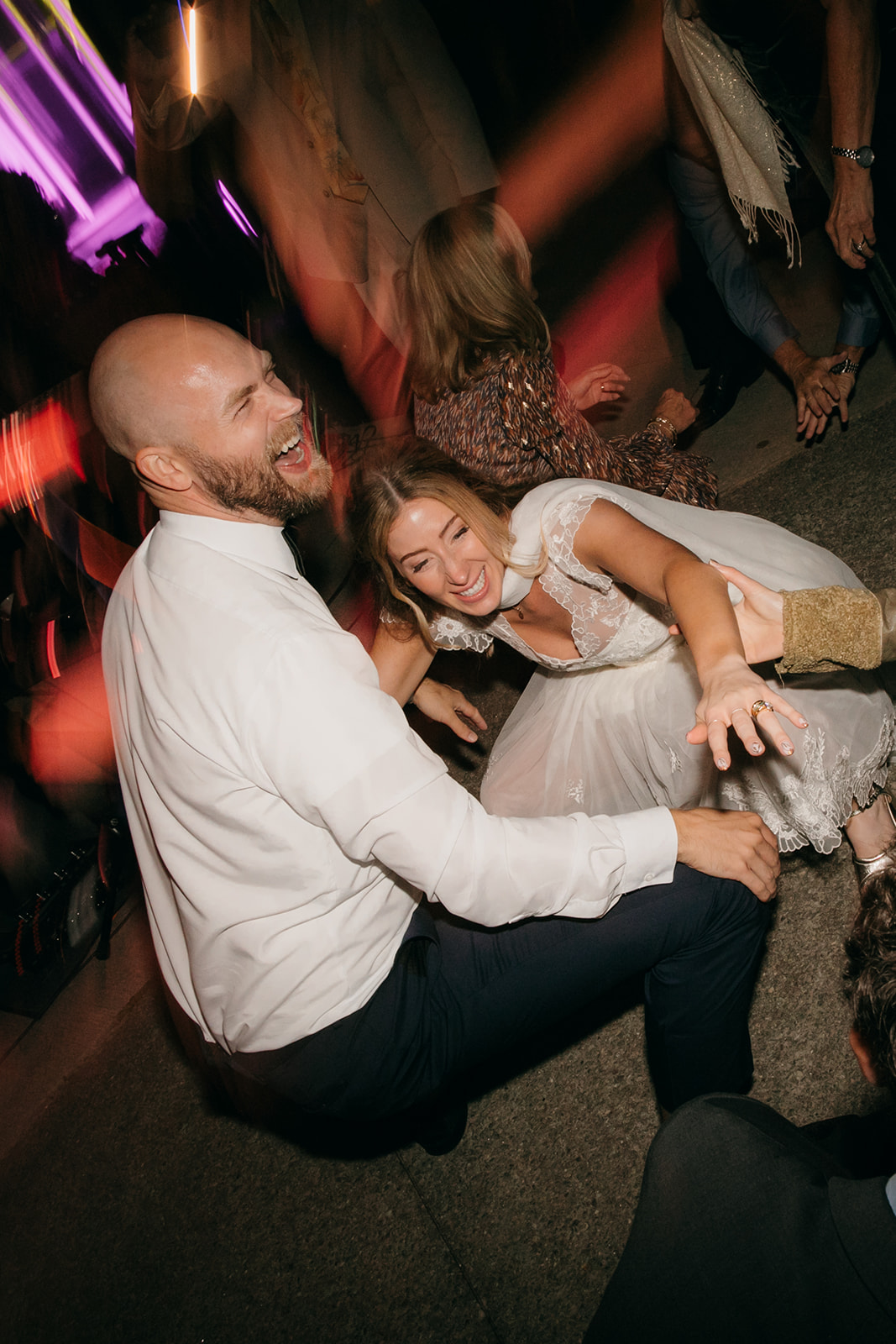 Bride and groom celebrating on the dance floor during an NC Arboretum wedding reception. 