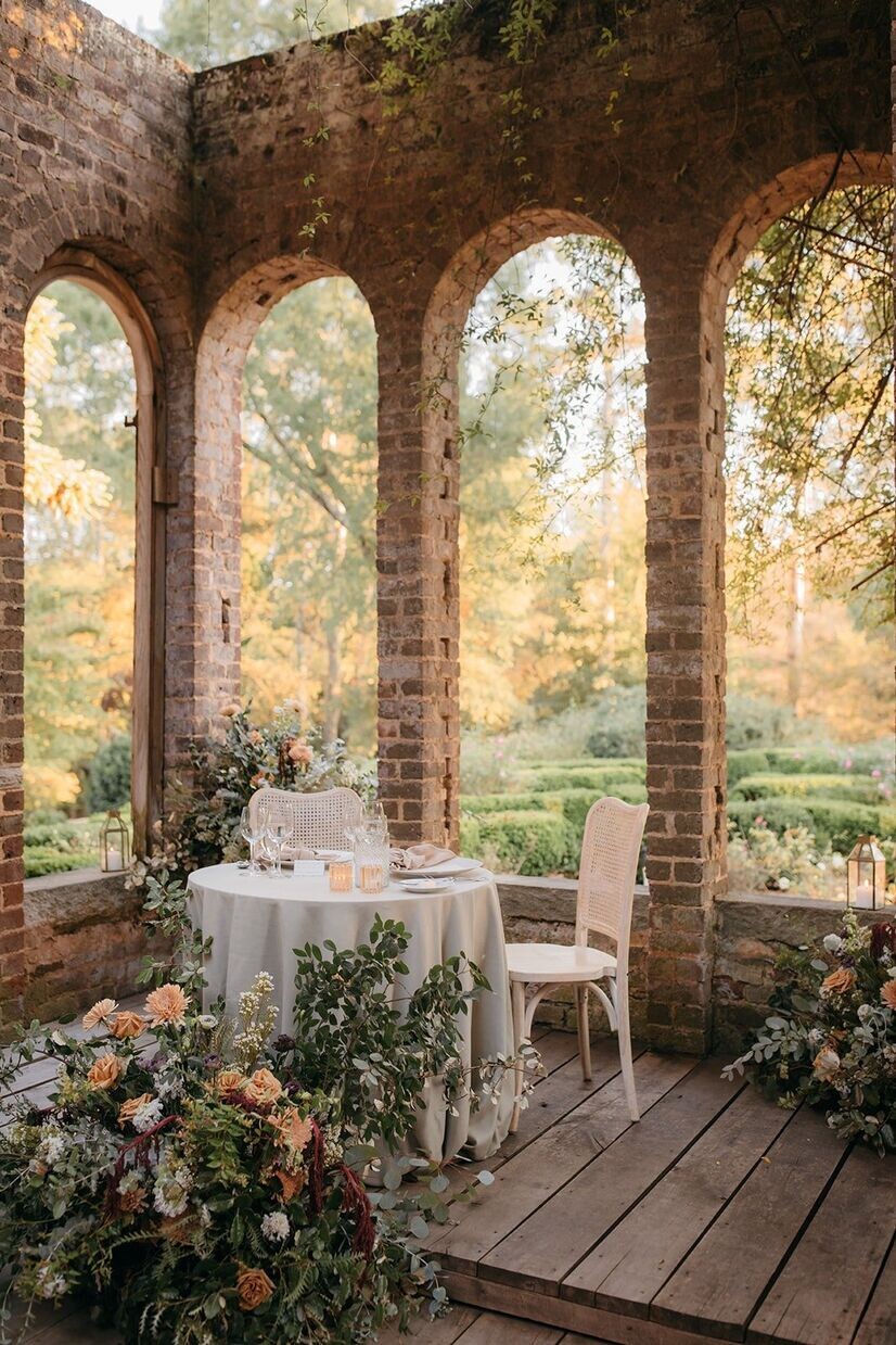 Brick archways and a set table for a Barnsley Garden wedding.