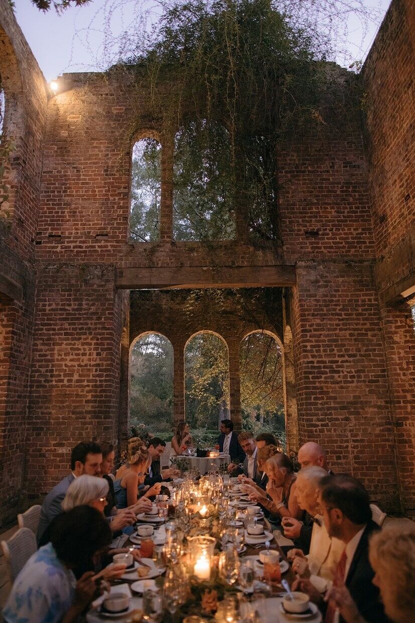 Guests enjoying each other's company at a reception at a Barnsley Garden wedding.